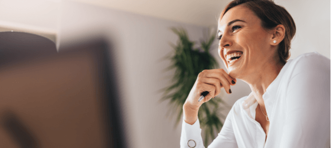Smiling young employee looks at her benefits package in ADP Workforce NOW