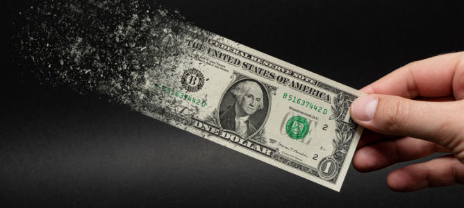 A dollar bill disintegrating