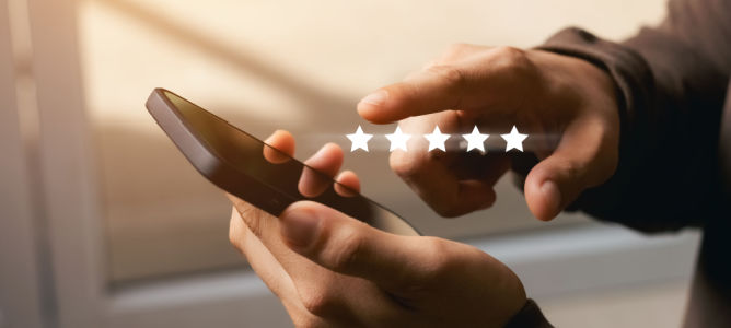 man giving user review with 5 star rating