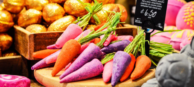 A display in a Lush store of bubble bars in the shape of carrots