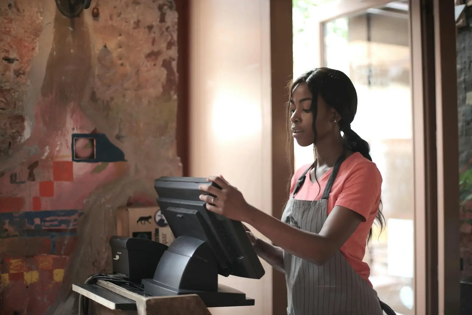woman behind a cash register